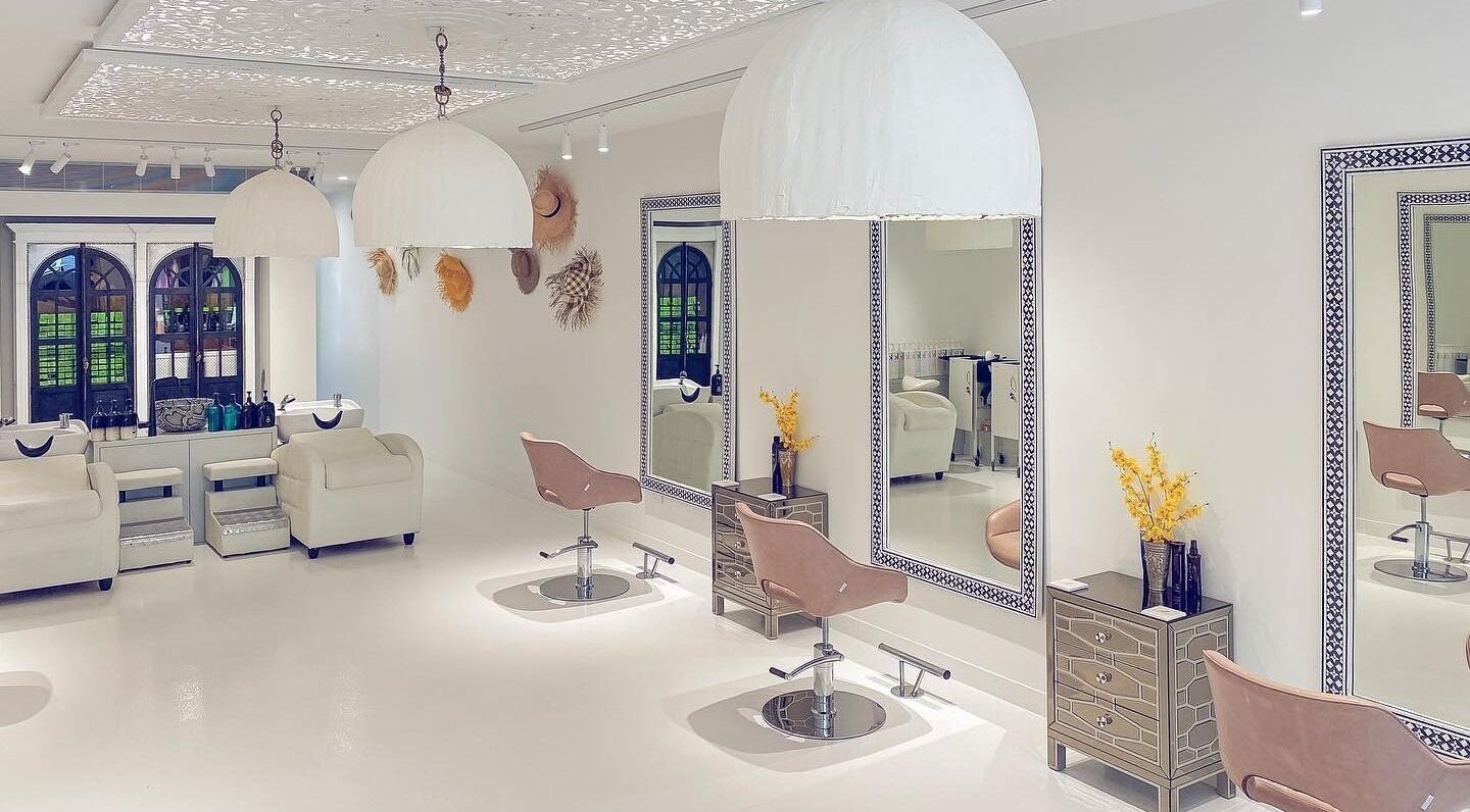 Elegant salon interior at Jacob Zinsli Salon, Surfers Paradise, Queensland, AU with chic chairs and mirrors.