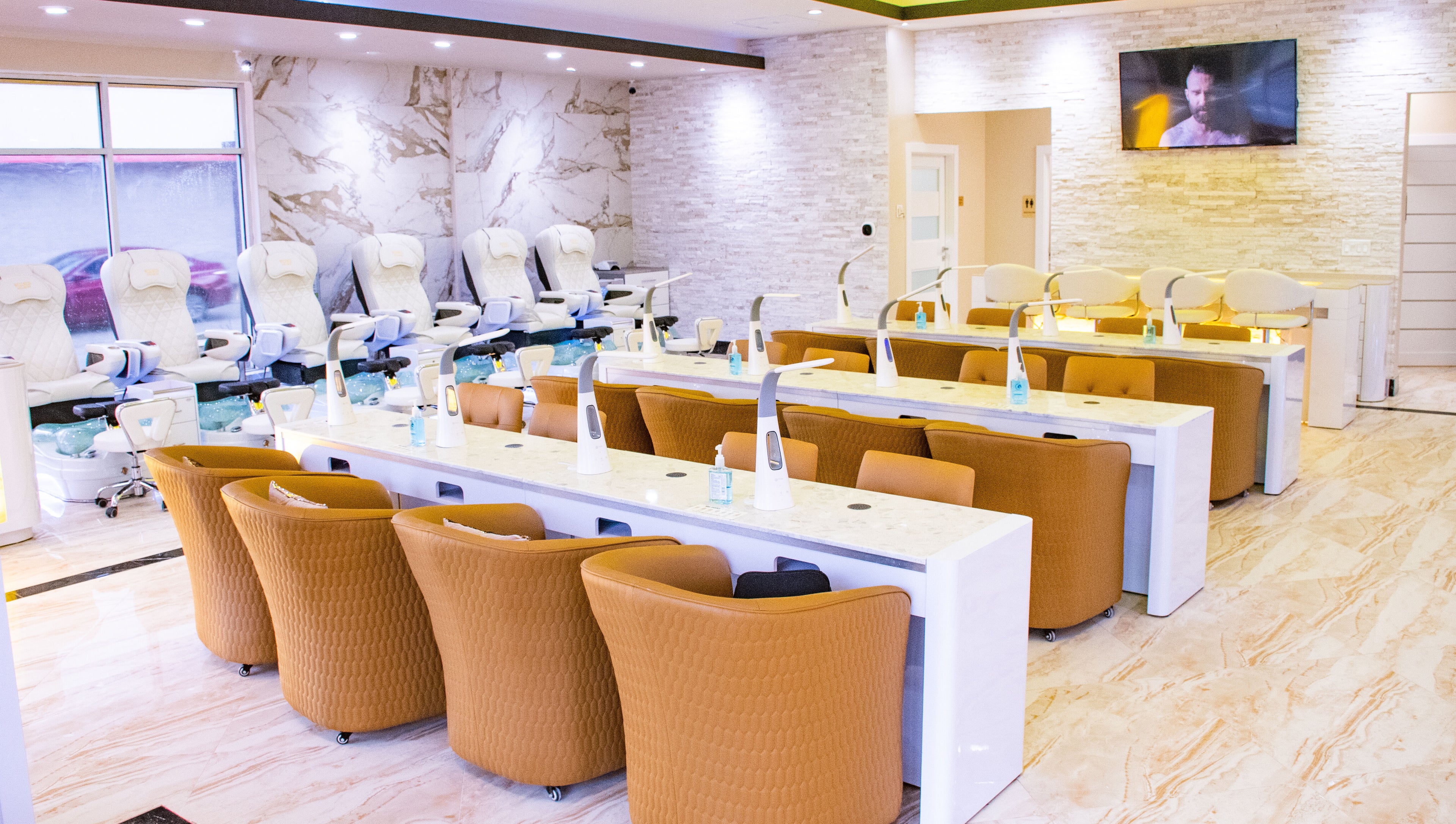 Spacious, chic interior of LUXEBABE NAILS & SPA LLC in Boynton Beach, Florida, US with luxury seating and decor.