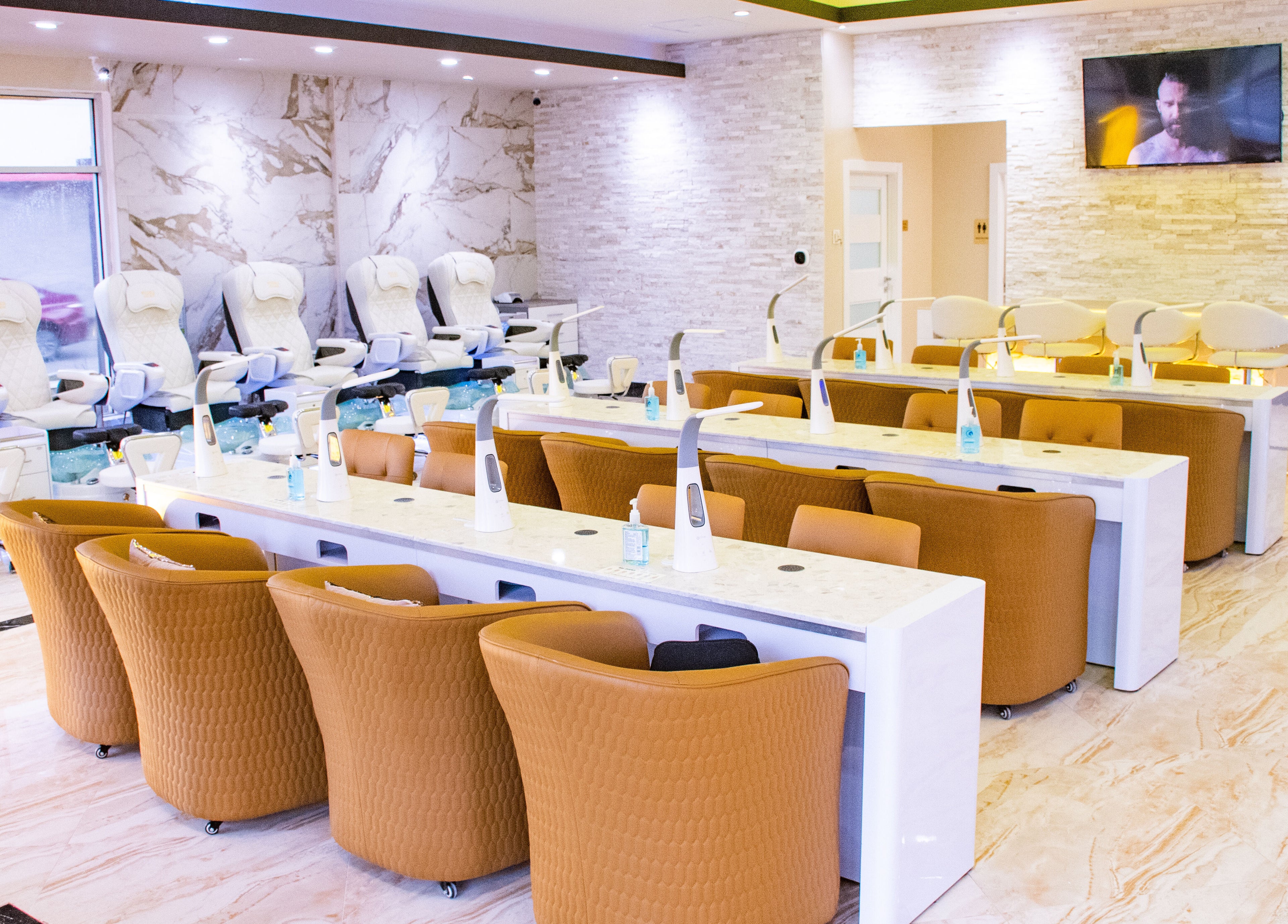 Spacious, chic interior of LUXEBABE NAILS & SPA LLC in Boynton Beach, Florida, US with luxury seating and decor.