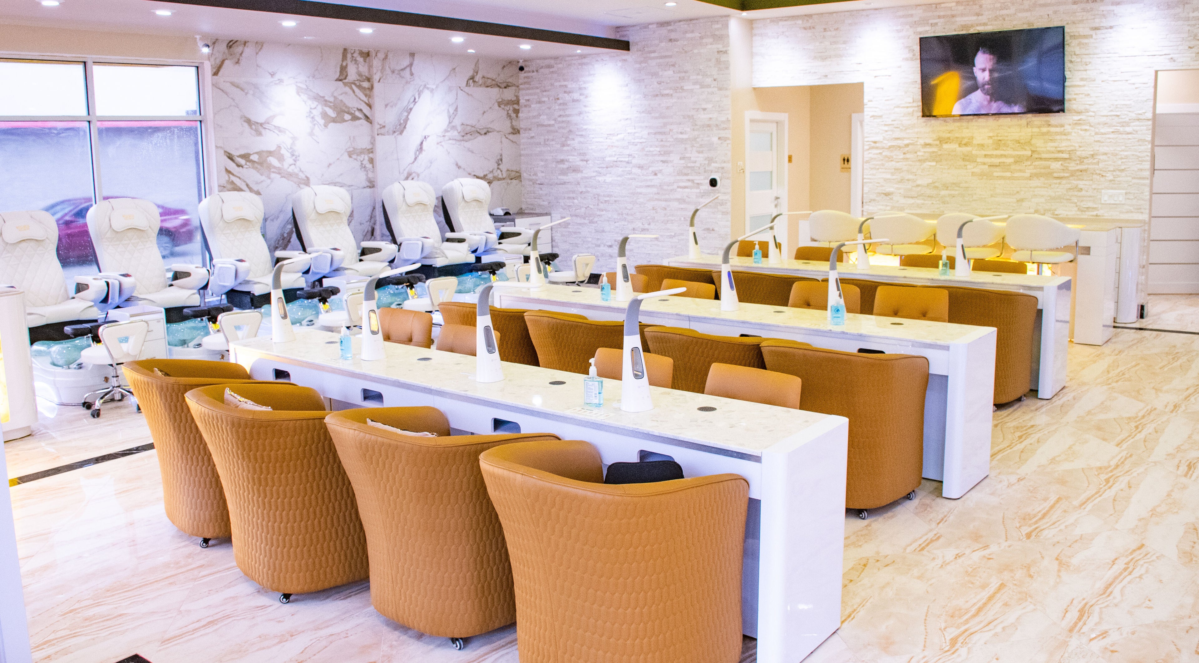 Spacious, chic interior of LUXEBABE NAILS & SPA LLC in Boynton Beach, Florida, US with luxury seating and decor.