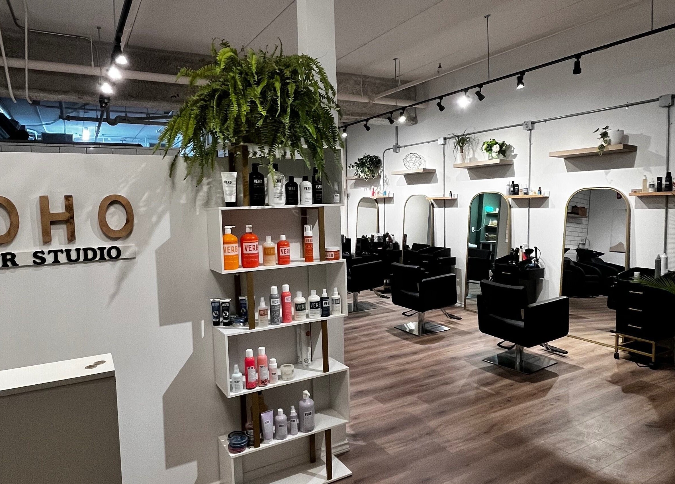 Inside Hair By Jordyn in Windsor, Ontario, CA, stylish chairs and products create a modern beauty salon atmosphere.