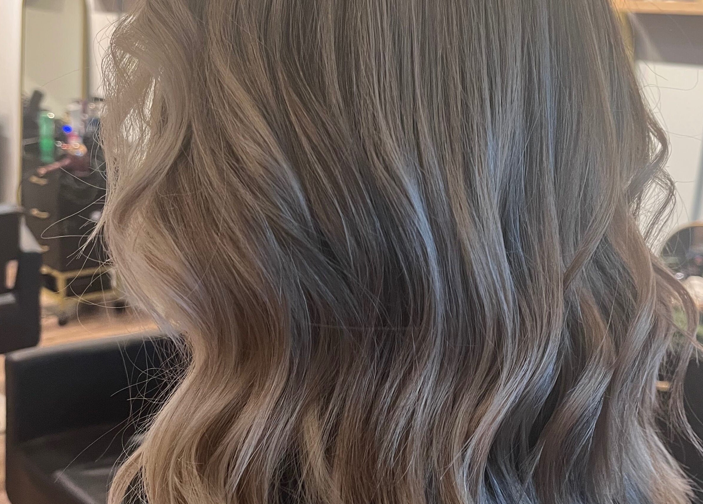 Beautiful wavy hairstyle crafted at Hair By Jordyn in Windsor, Ontario, CA, showcasing expert styling.