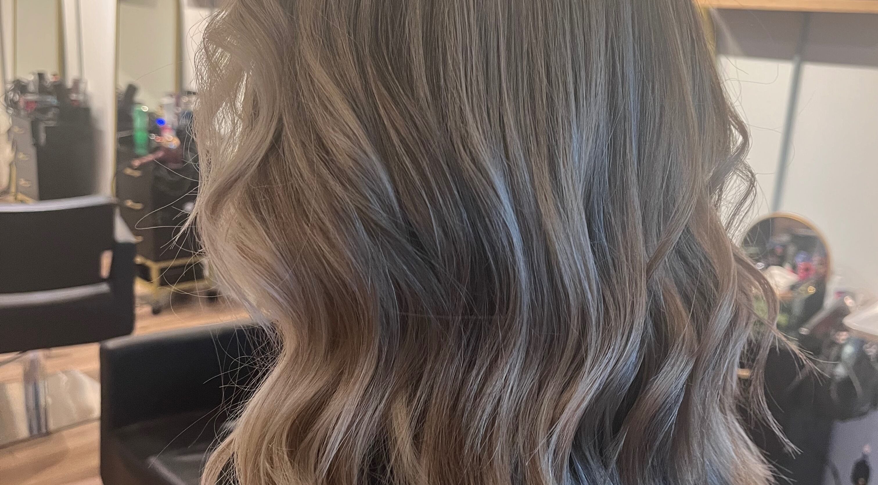 Beautiful wavy hairstyle crafted at Hair By Jordyn in Windsor, Ontario, CA, showcasing expert styling.