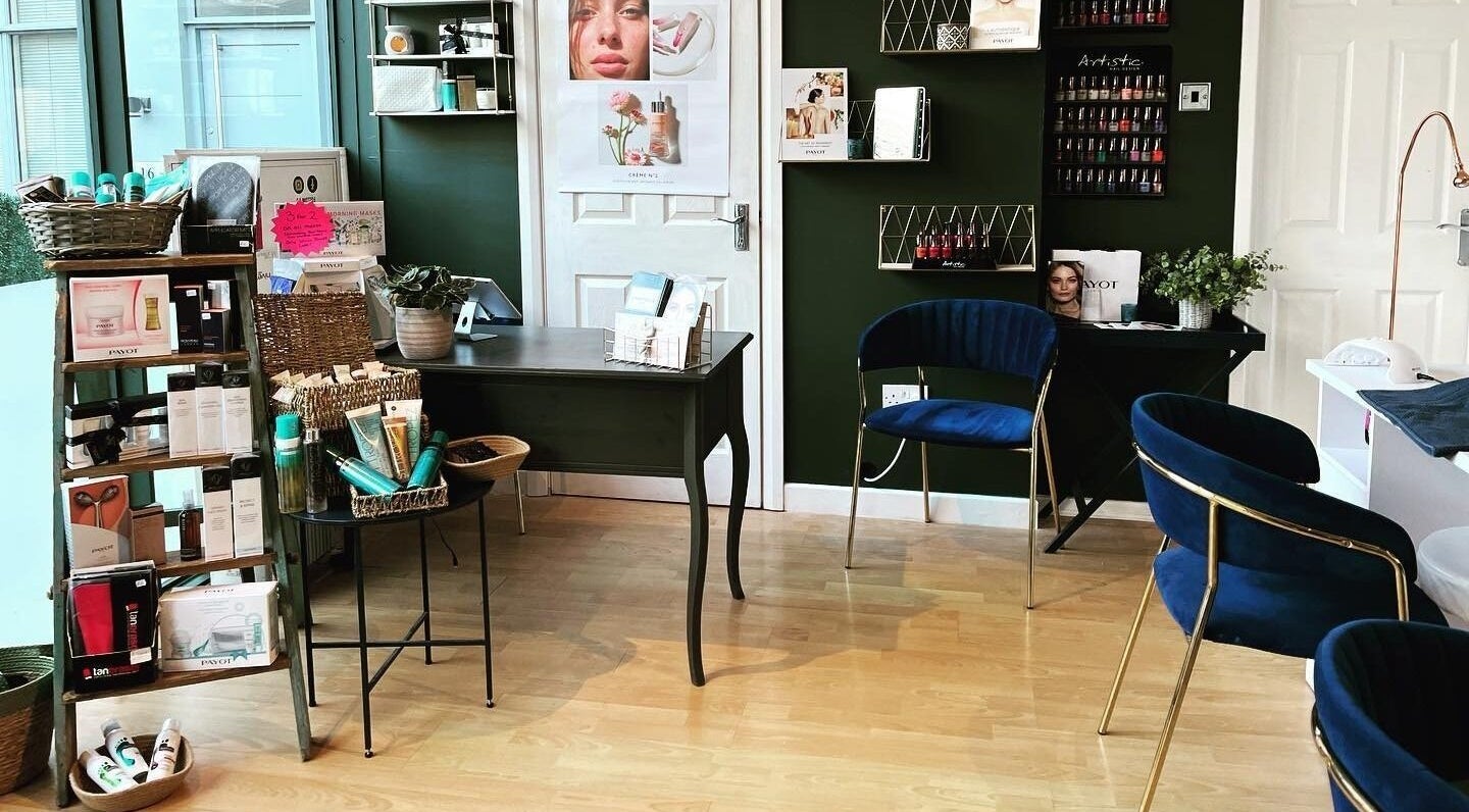 Inside Queens Parlour, Macclesfield, England, GB, showcasing product displays and sleek seating.