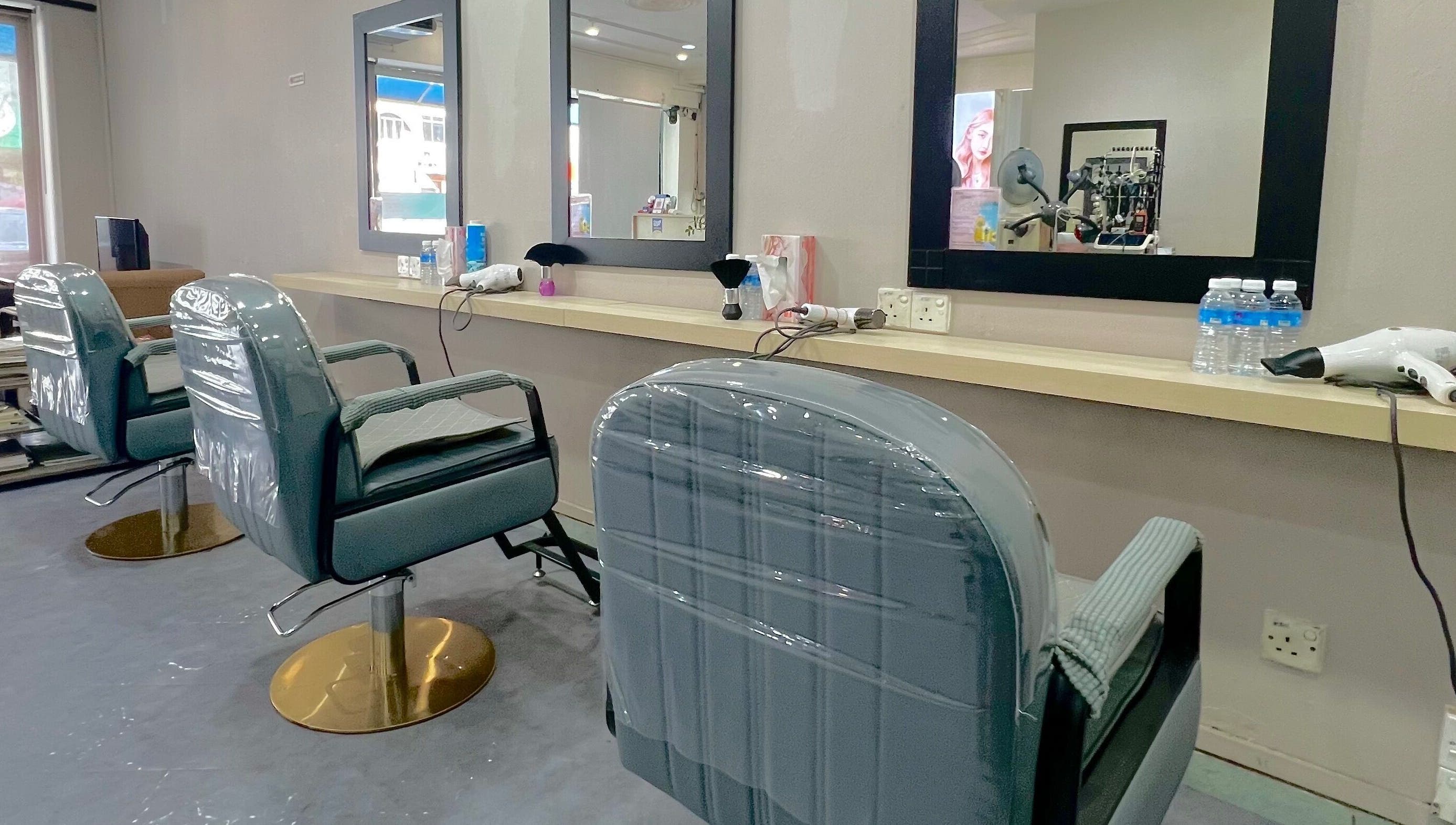 Modern salon chairs at Hair Moment Salon in Subang Jaya, Selangor, MY, ready for the next client.