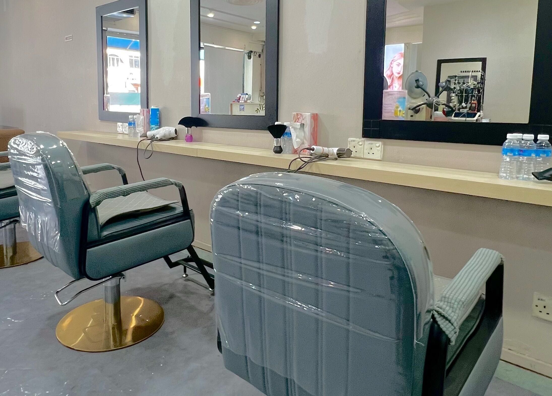 Modern salon chairs at Hair Moment Salon in Subang Jaya, Selangor, MY, ready for the next client.