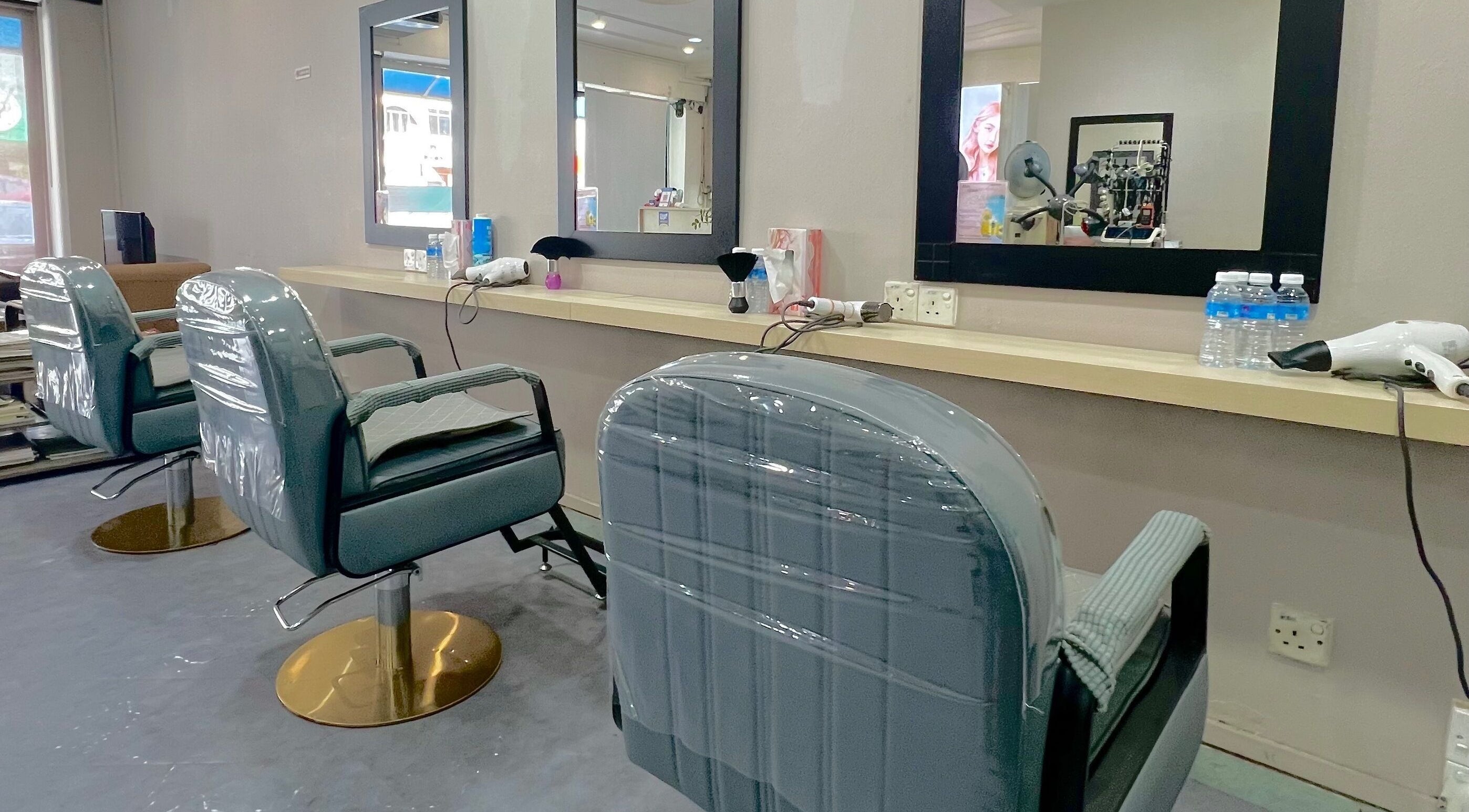 Modern salon chairs at Hair Moment Salon in Subang Jaya, Selangor, MY, ready for the next client.