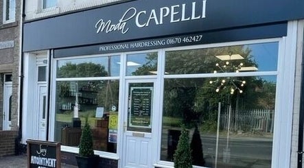 Exterior view of Moda Capelli salon in Ashington, England, GB, showcasing modern design and styling.