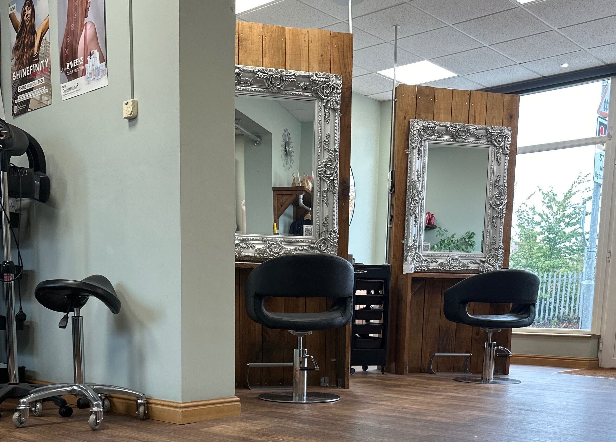 Chic interior of Moda Capelli in Ashington, England with stylish mirrors and salon chairs.