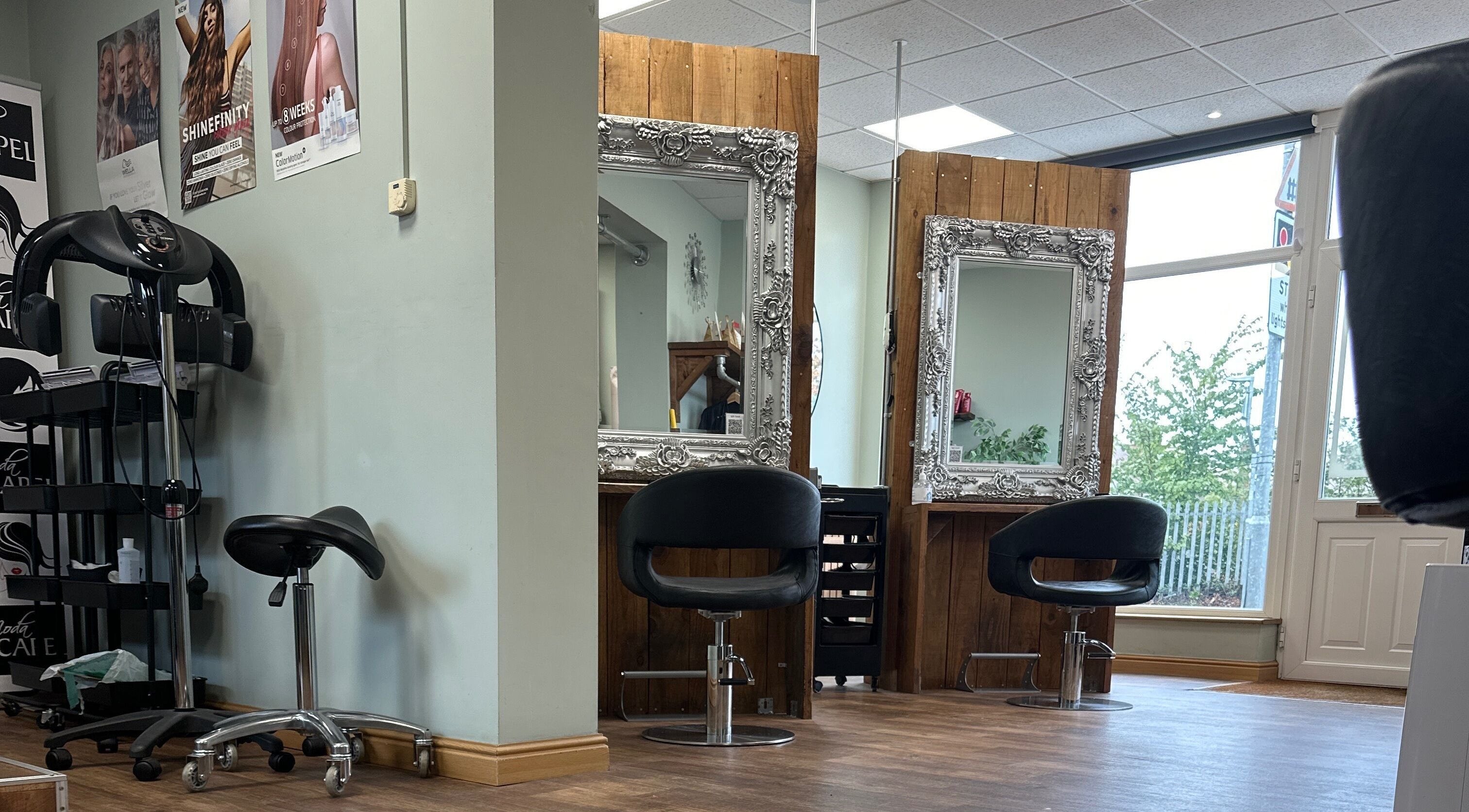 Chic interior of Moda Capelli in Ashington, England with stylish mirrors and salon chairs.