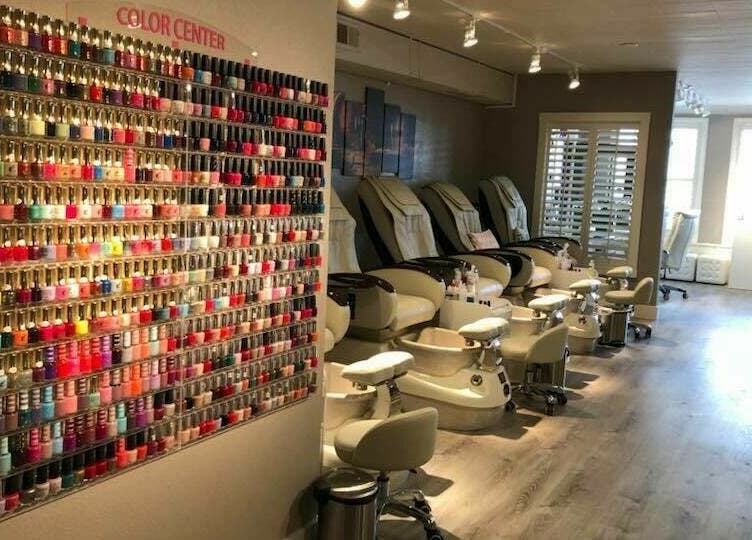 Vibrant nail polish display and pedicure chairs at Lace Nails - Lake Oswego, Oregon, US.