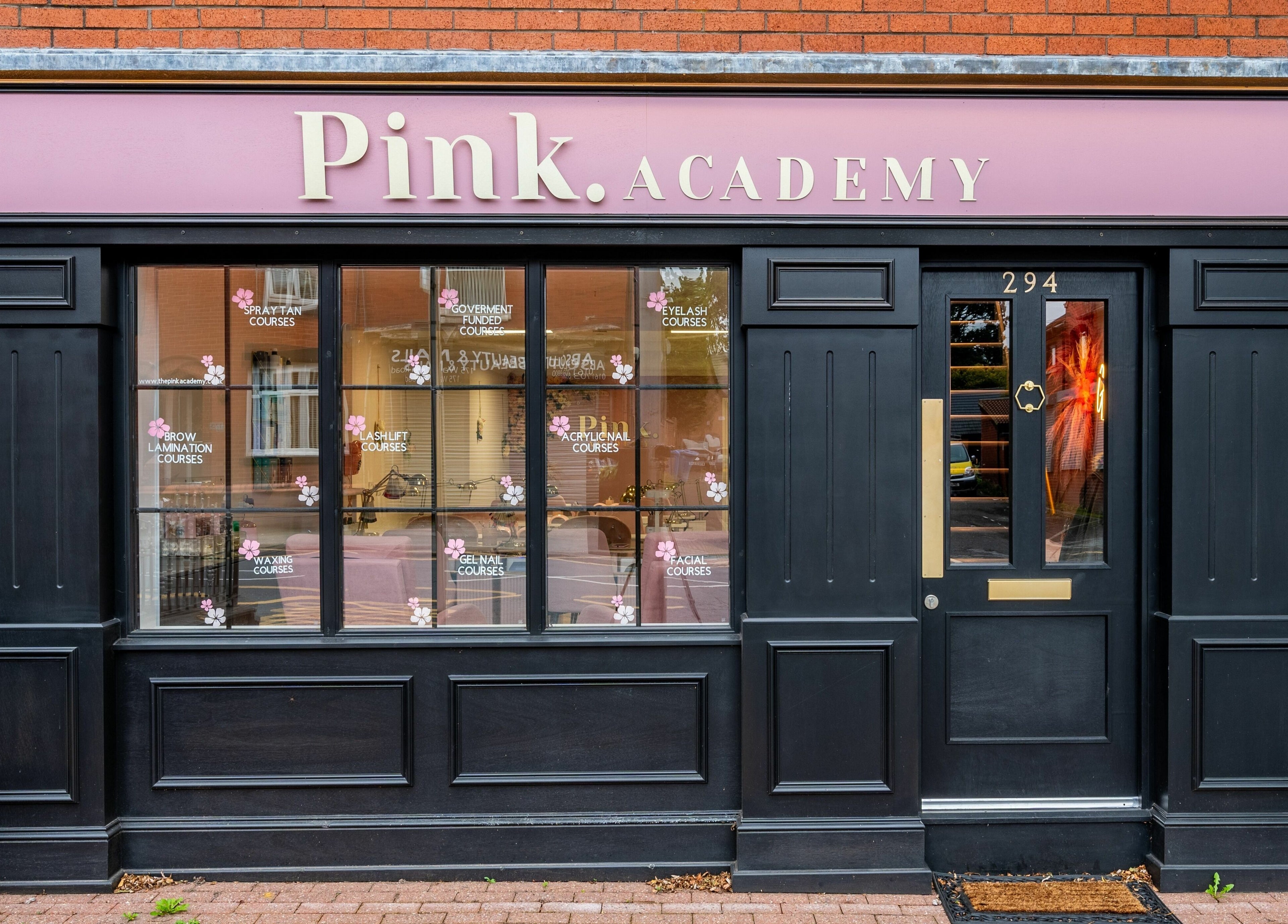 Front of Pink. Academy, a beauty venue in Worsley, England, GB with stylish signage.