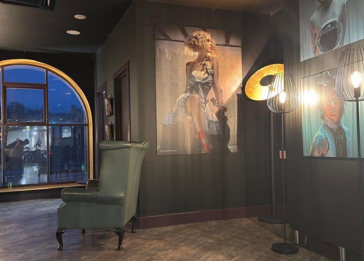 Stylish salon interior at Nelson Brown in Dumfries, Scotland featuring modern decor and elegant artwork.