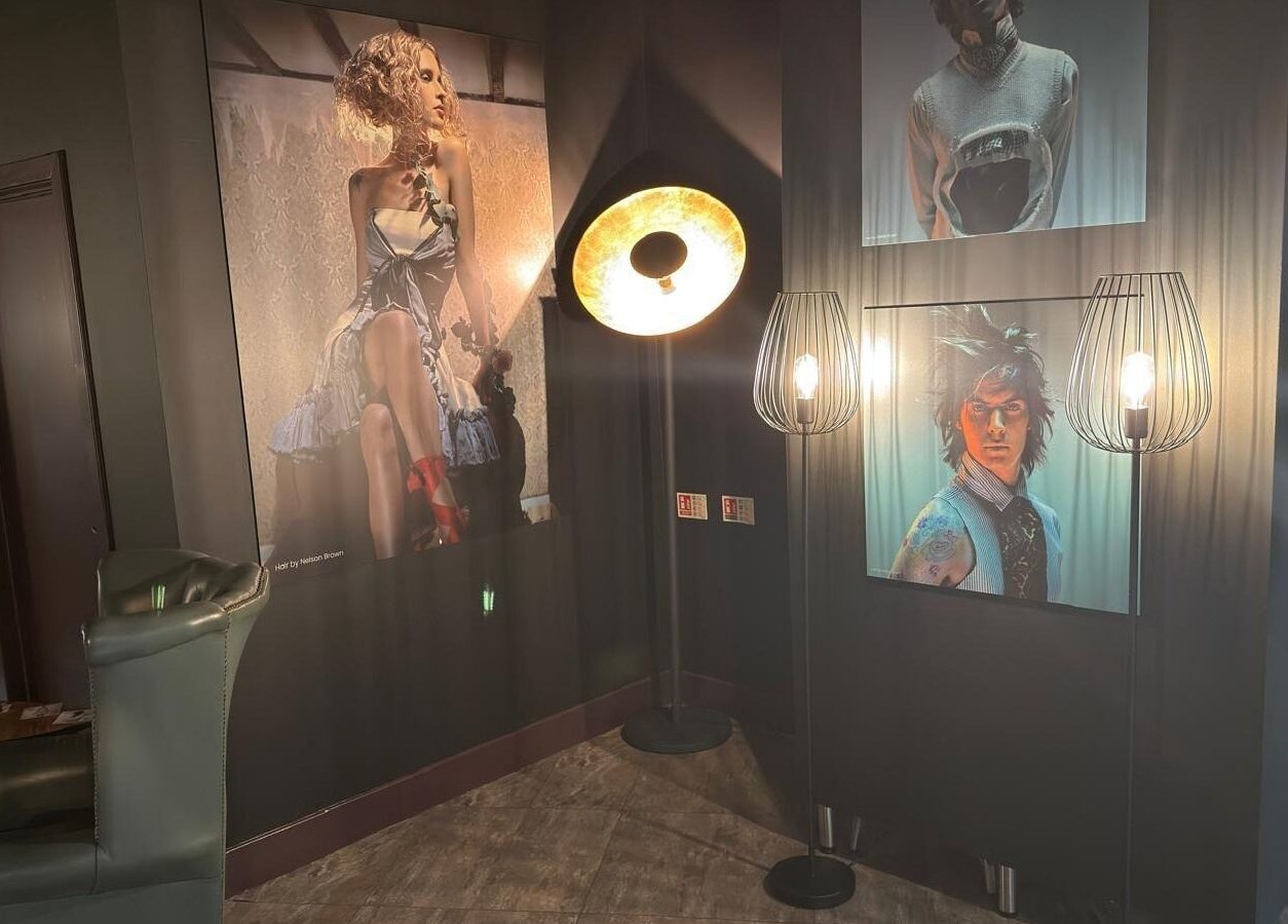 Stylish wall art and ambient lighting at Nelson Brown, Dumfries, Scotland, GB, showcasing modern beauty trends.