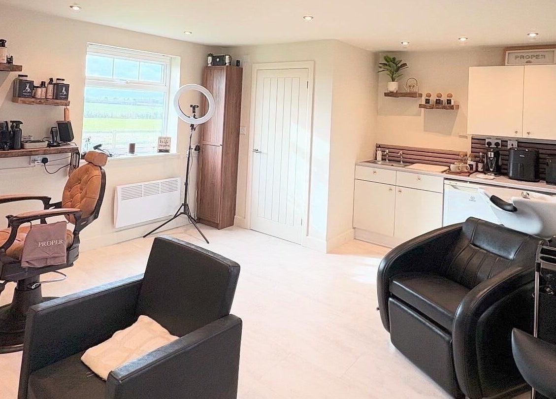 Modern salon interior at Proper Beauty Chicheley in Newport Pagnell, England, GB with stylish chairs and equipment.