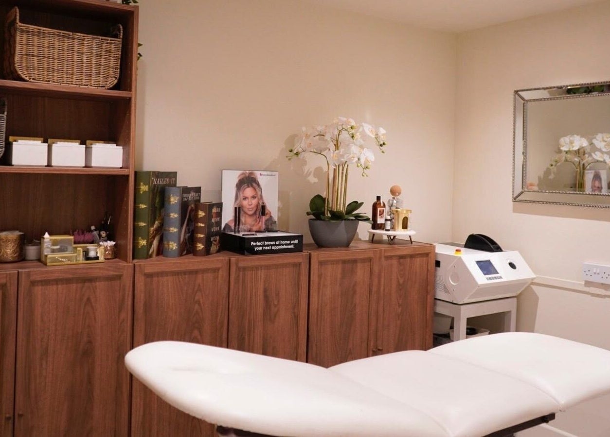 Elegant therapy room at Proper Beauty Chicheley, Newport Pagnell, England, GB with cozy decor and treatment table.