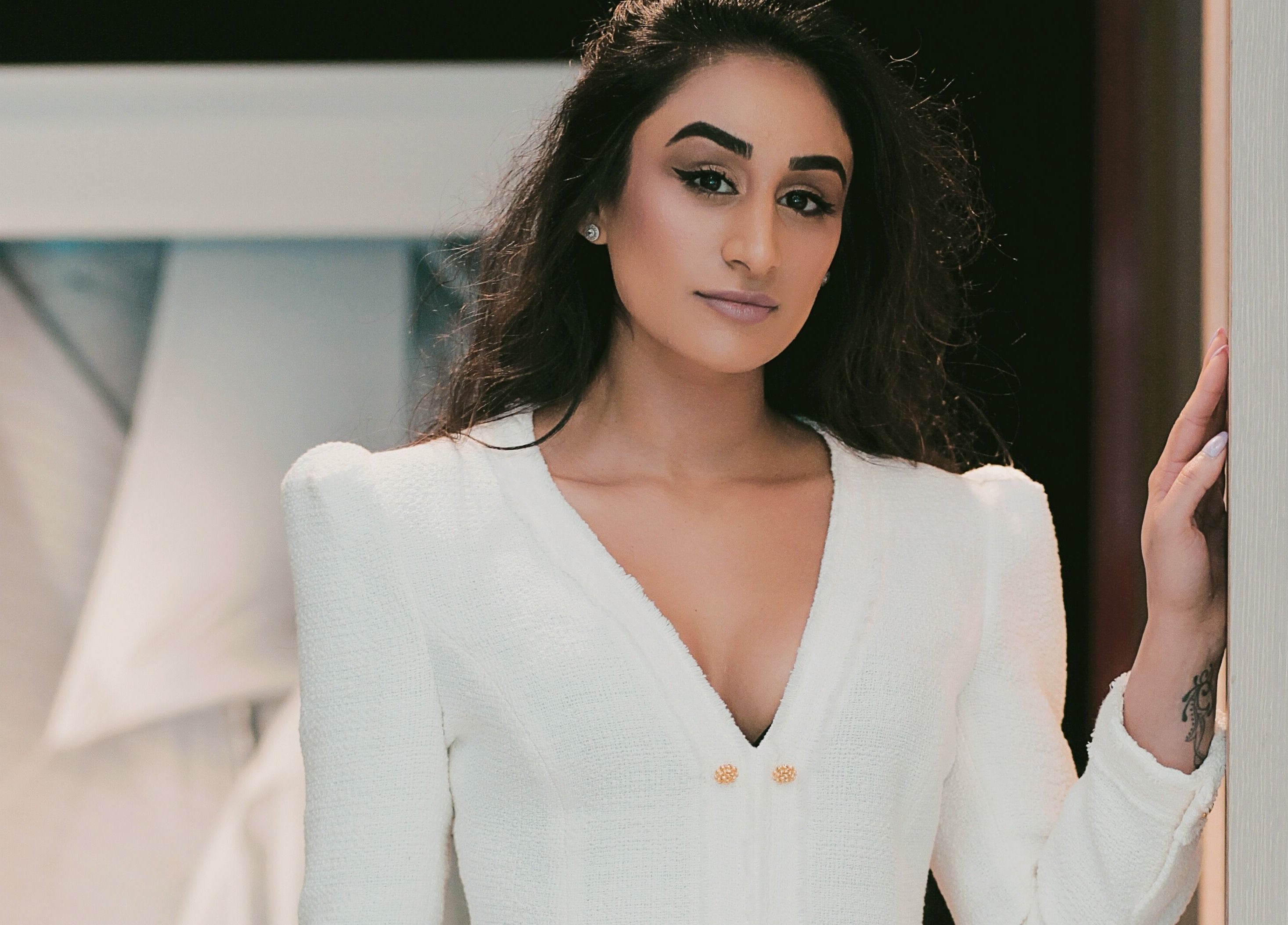 Stylish woman in white at Proper Beauty Chicheley, Newport Pagnell, England, GB.