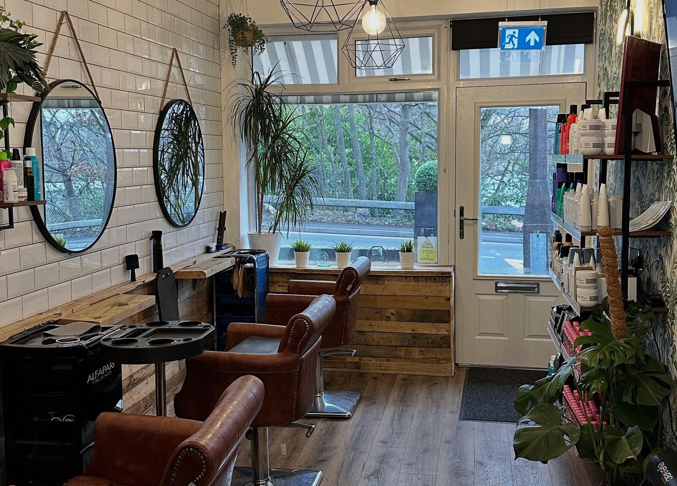 Modern salon interior at Christopher at BLUNT FRINGE Salon in Rowley Regis, England, GB with stylish decor.