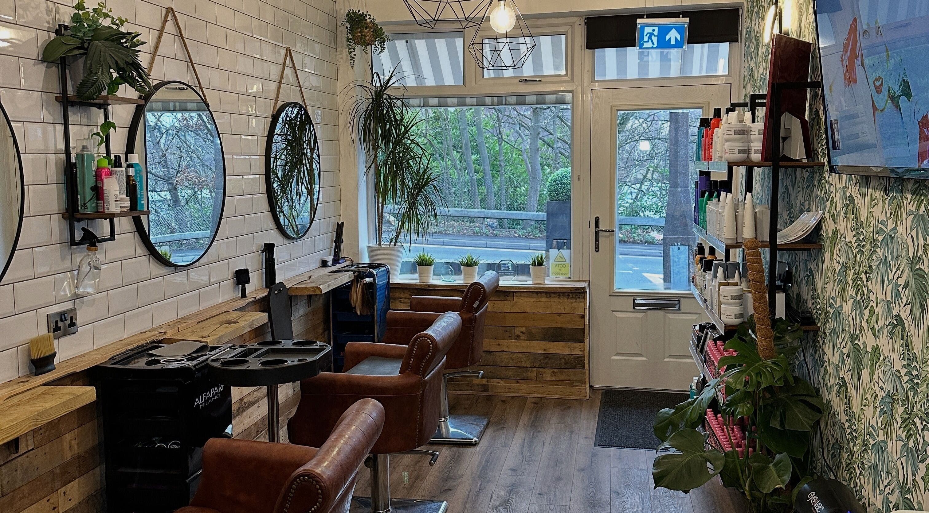 Modern salon interior at Christopher at BLUNT FRINGE Salon in Rowley Regis, England, GB with stylish decor.