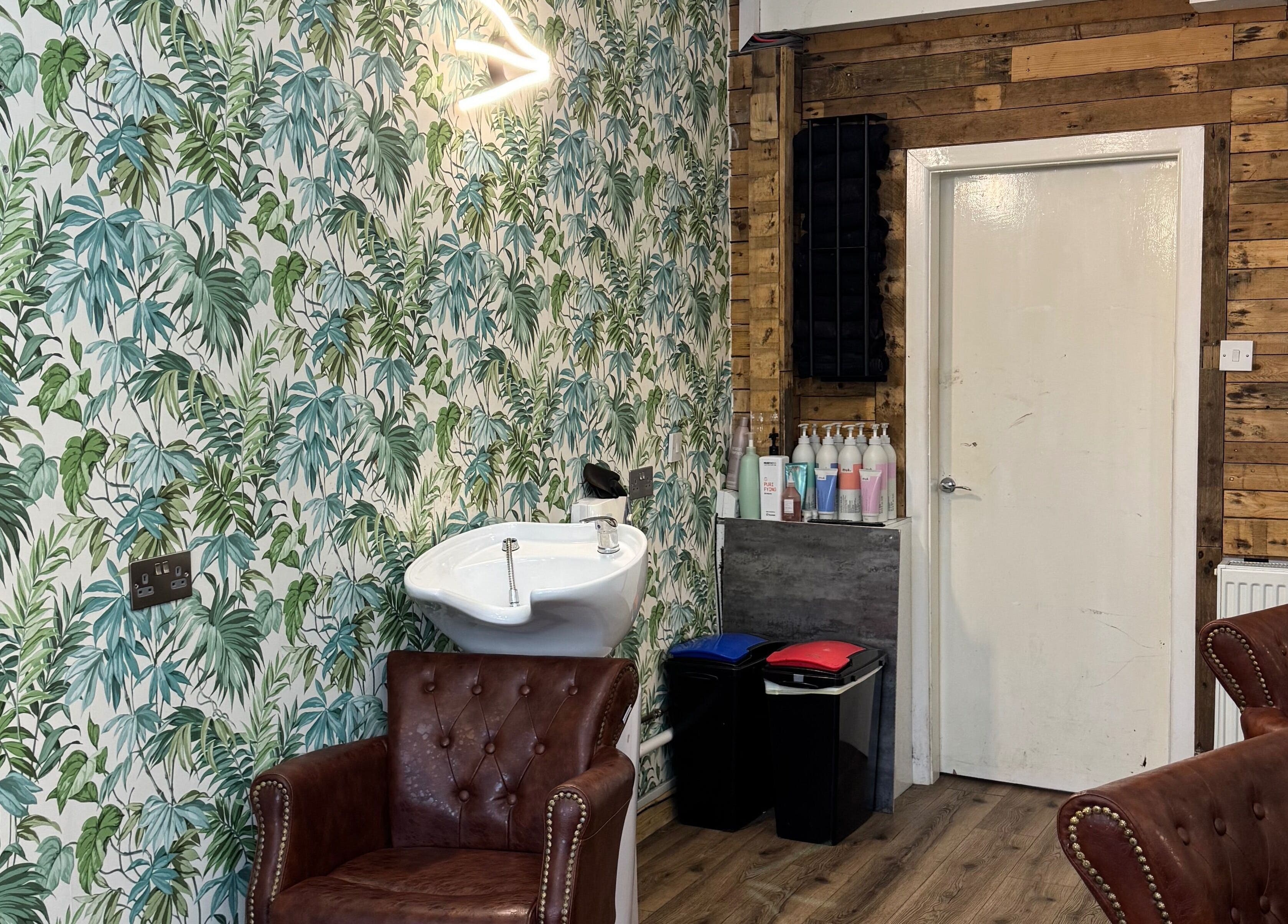 Elegant tropical-themed interior at Christopher at BLUNT FRINGE Salon, Rowley Regis, England, GB.