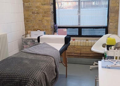 A cozy treatment room at Rachel’s Beauty Treatments in London, England, GB, featuring a comfortable massage bed.
