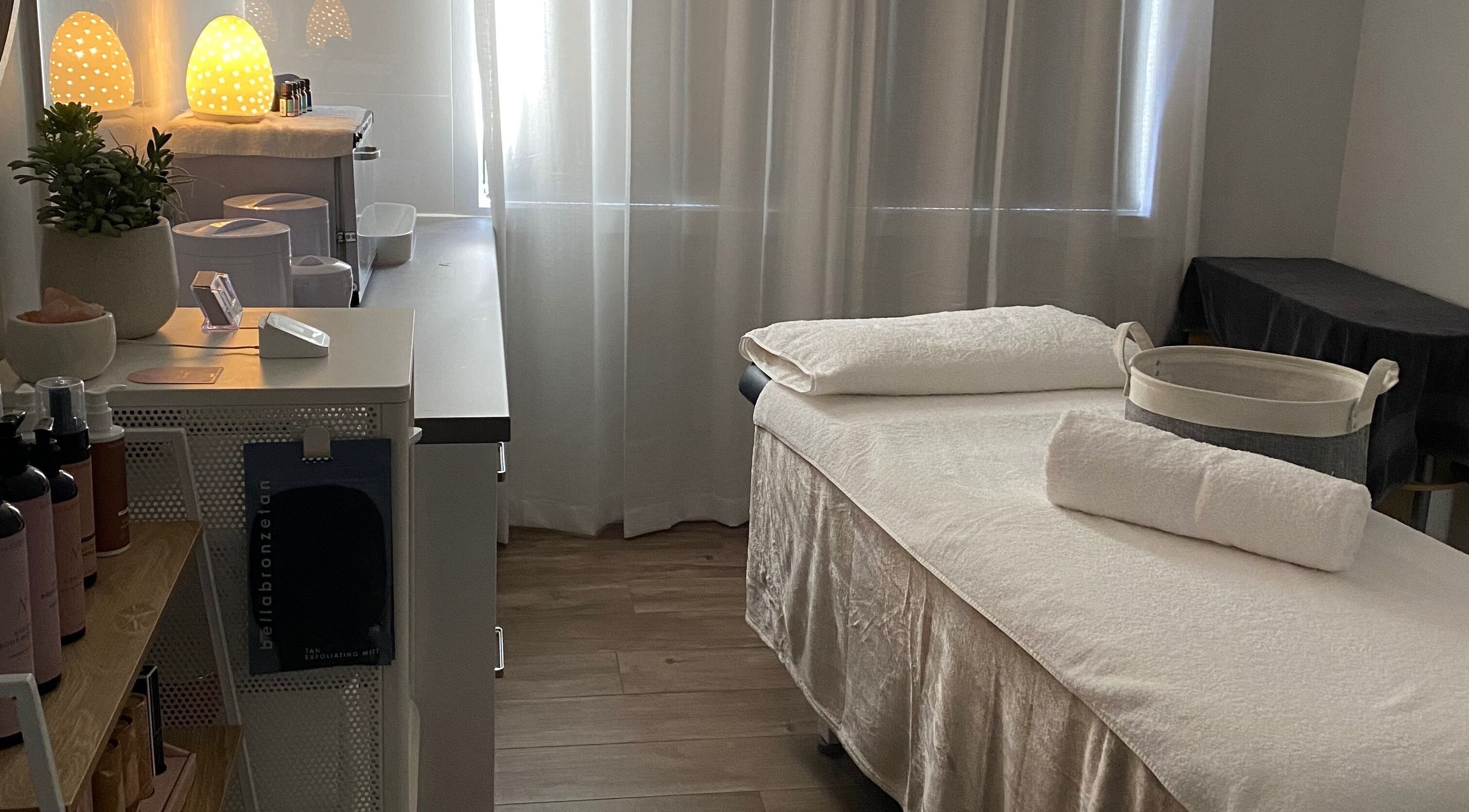 Relaxing treatment room at Ivyleigh Beauty Therapy, Melbourne, Victoria, AU, with soft lighting and a massage bed.