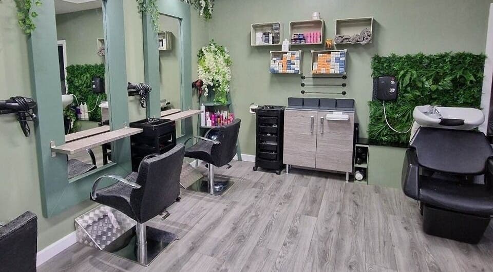 Modern salon seating at Avenue One in Dunfermline, Scotland, GB with stylish decor and greenery.