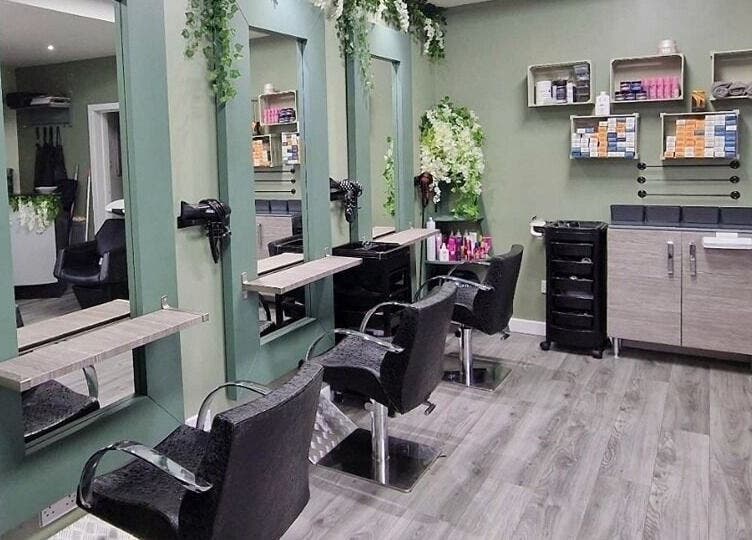 Chic styling area at Avenue One, Dunfermline, Scotland, GB, featuring chairs and mirrors amid lush decor.