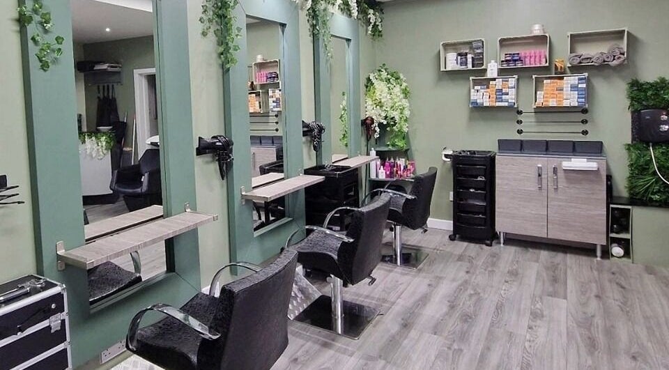 Chic styling area at Avenue One, Dunfermline, Scotland, GB, featuring chairs and mirrors amid lush decor.