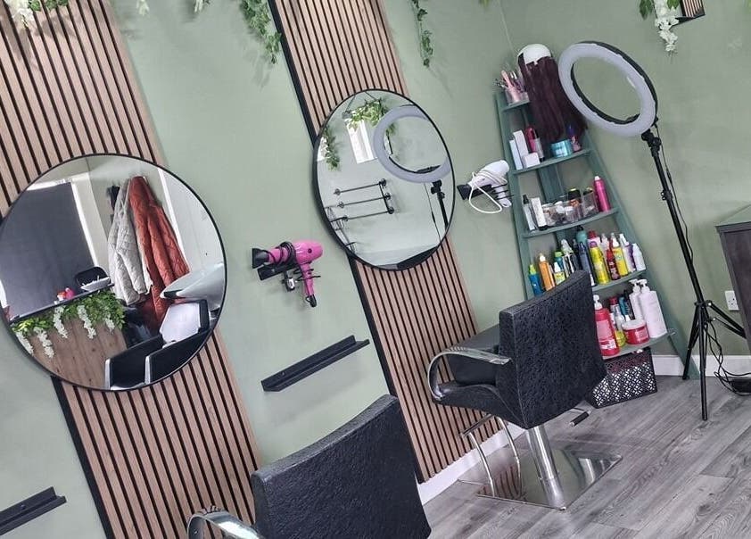 Modern salon interior at Avenue One, Dunfermline, Scotland, GB with stylish chairs and mirrors.
