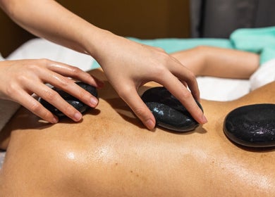 Hot stone massage at Siam Spa - Therapeutic Massage & Wellness Cannon Hill, Cannon Hill, Queensland, AU.