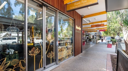 Entrance of Siam Spa – Therapeutic Massage & Wellness Bulimba in Bulimba, Queensland, AU adorned with floral decor.
