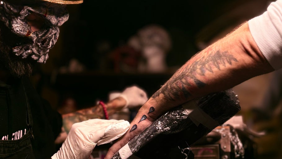 Artist creating tattoo at Scoogz Art and Tattoos, Glenmore Park, New South Wales, AU.