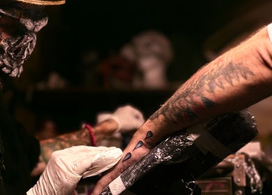 Artist creating tattoo at Scoogz Art and Tattoos, Glenmore Park, New South Wales, AU.