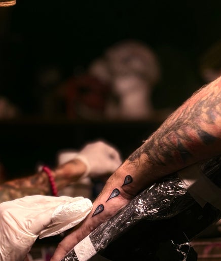 Artist creating tattoo at Scoogz Art and Tattoos, Glenmore Park, New South Wales, AU.