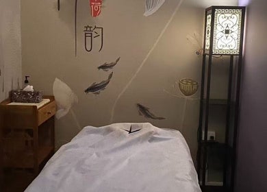 Serene spa room at Kerry's Body Therapy - Millner Shop featuring a massage table and elegant decor.
