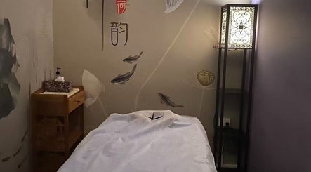 Serene spa room at Kerry's Body Therapy - Millner Shop featuring a massage table and elegant decor.