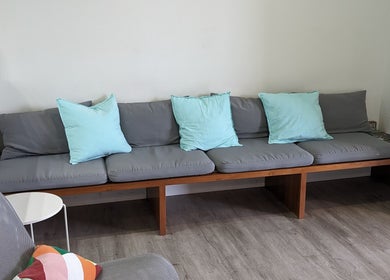 Comfy seating area at Sage Kids Family Salon & Piercing Boutique in West Linn, Oregon, US. Inviting and modern.