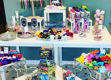 Colorful hair accessories display at Sage Kids Family Salon & Piercing Boutique, West Linn, Oregon, US.