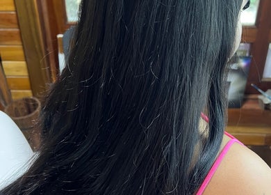 Close-up of sleek black hair at CG Bella Extensions, St Thelmo by Abrazos hotel, San Pedro, BZ.
