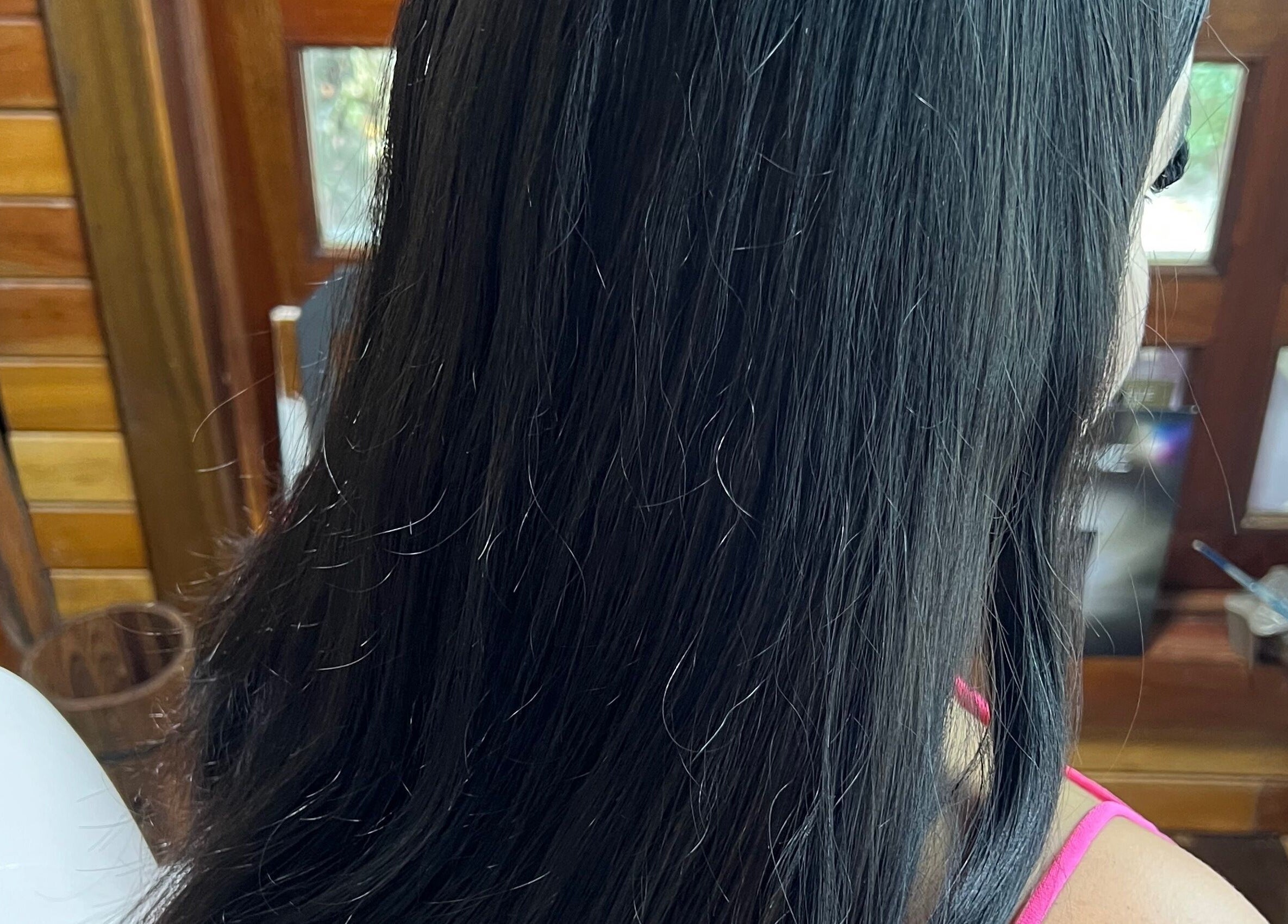 Long black hair styled at CG Bella Extensions in St Thelmo by Abrazos hotel, San Pedro, BZ.