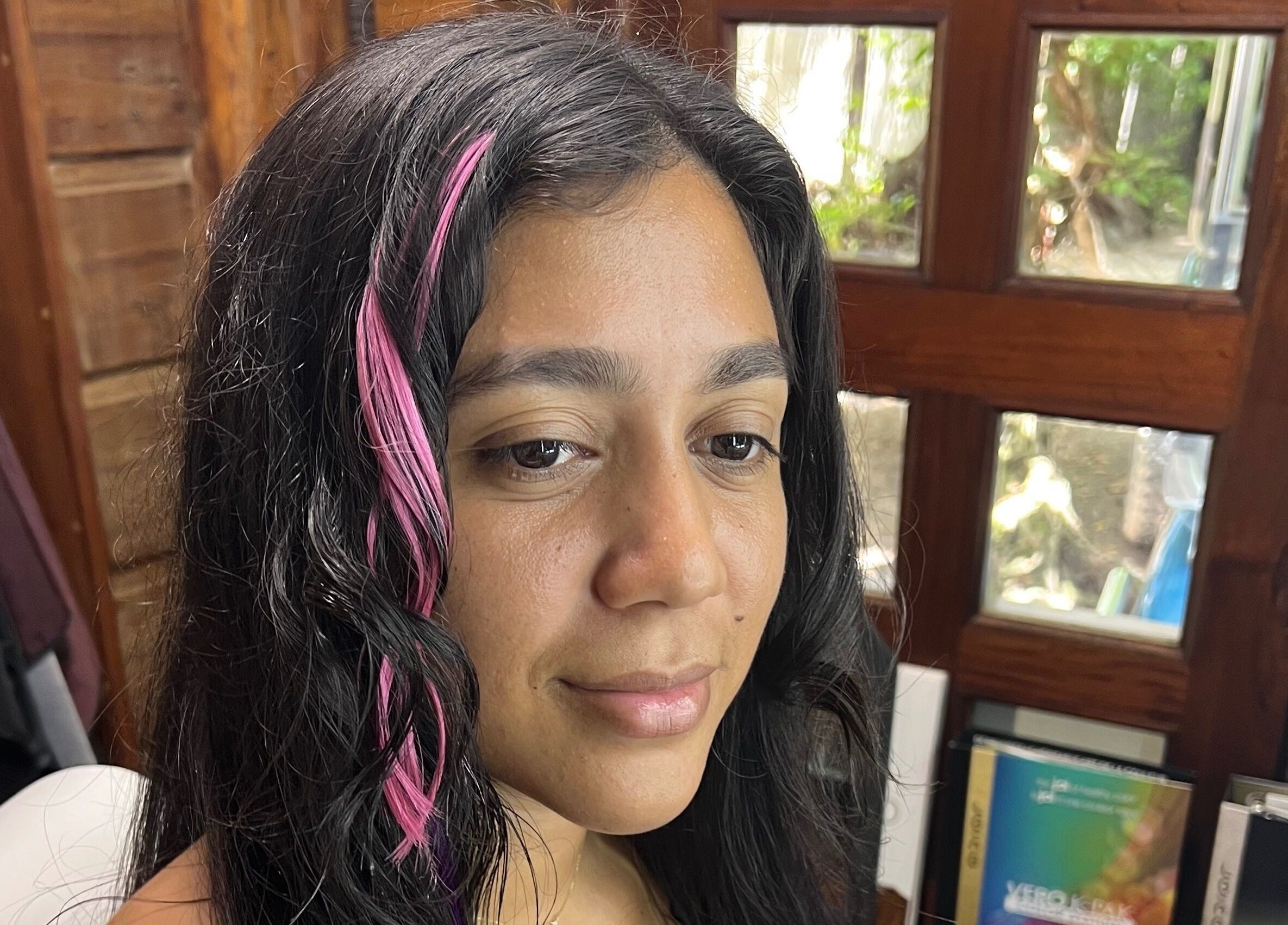 Pink hair extensions styled at CG Bella Extensions, St Thelmo by Abrazos hotel, San Pedro, BZ for a modern look.