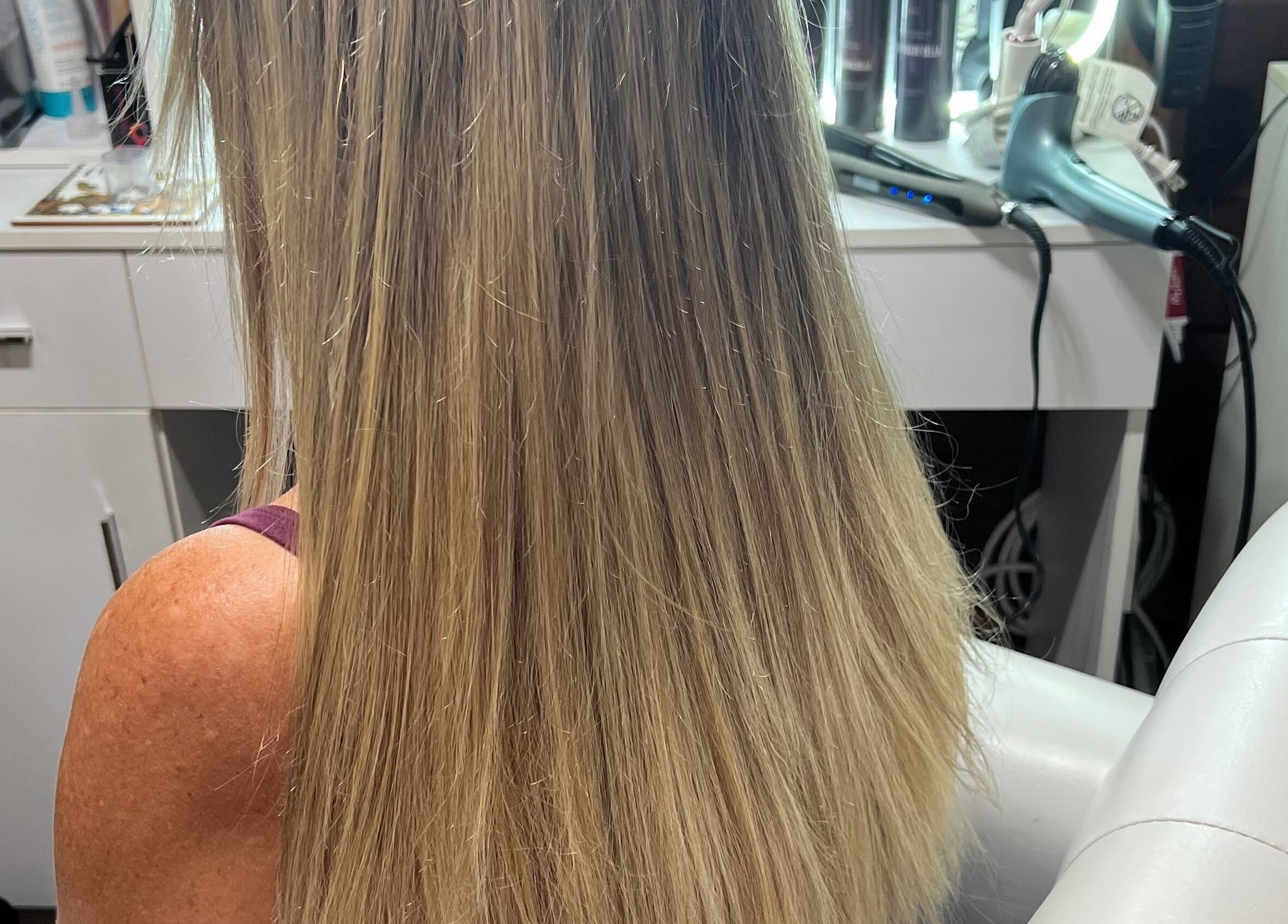 Beautiful long blonde hair styled at CG Bella Extensions, St Thelmo by Abrazos hotel in San Pedro, BZ.