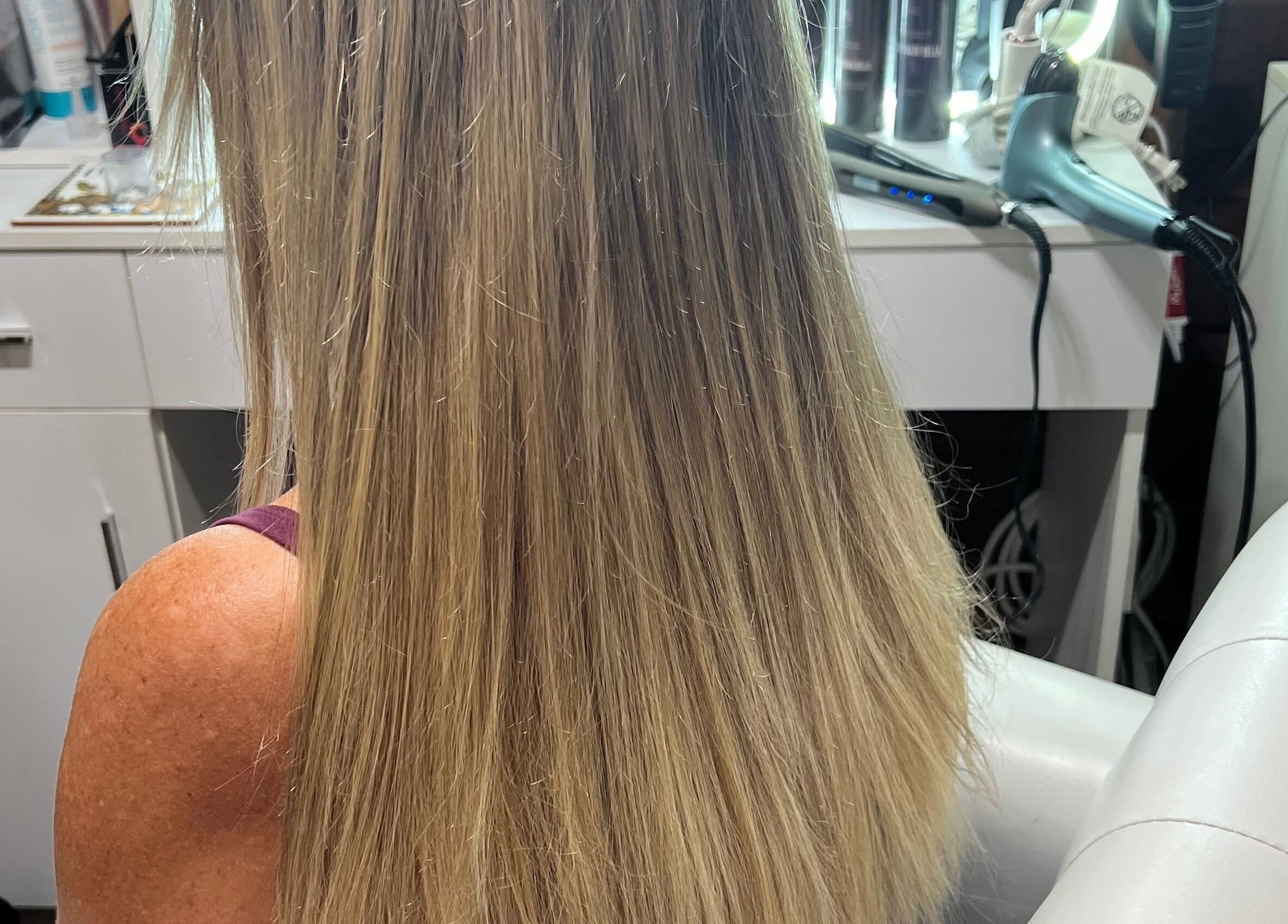 Beautiful long blonde hair styled at CG Bella Extensions, St Thelmo by Abrazos hotel in San Pedro, BZ.