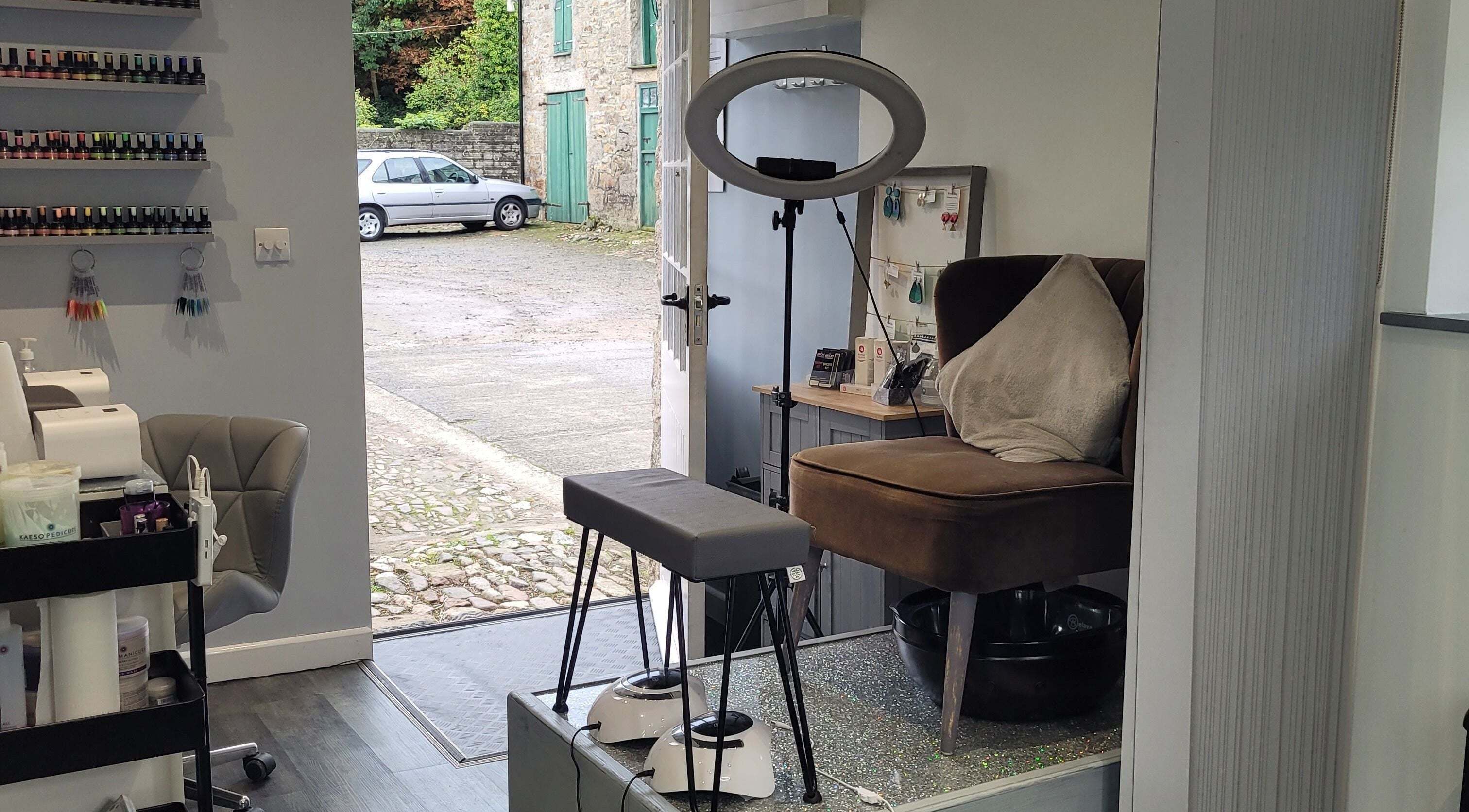 Cozy salon corner at The Beauty Barn in Hayle, England, GB showcasing manicure and pedicure setup.