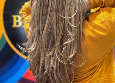 Elegant golden hair at Yo Barbra in Bacchus Marsh, Victoria, AU with vibrant rainbow backdrop.