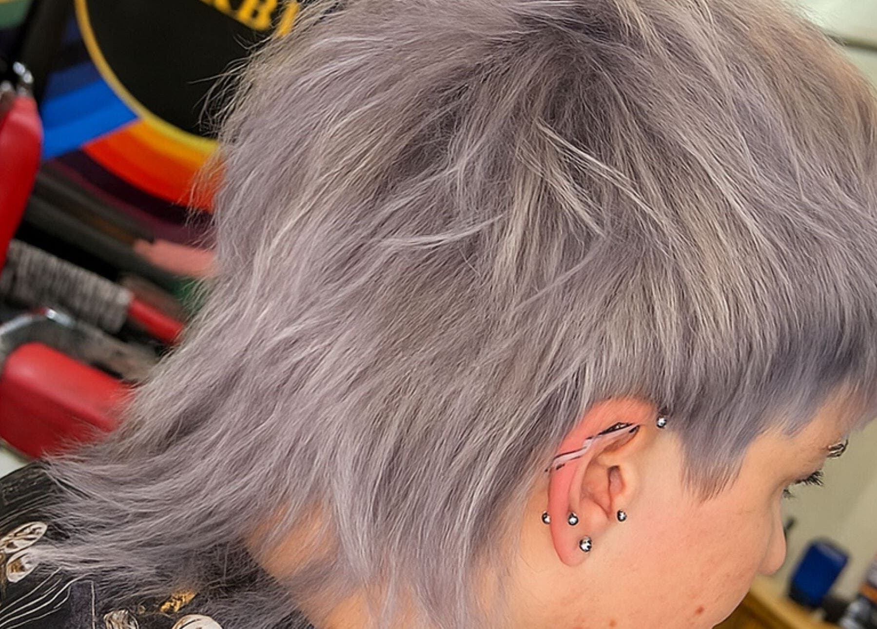 Trendy silver hairstyle showcased at Yo Barbra in Bacchus Marsh, Victoria, AU, highlighting modern hair design.