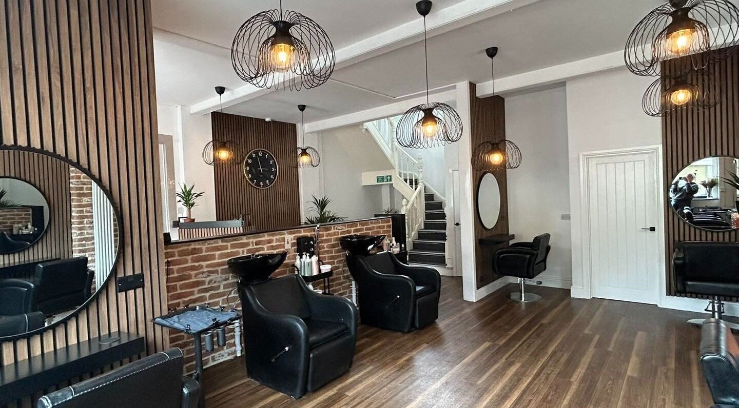 Modern salon interior at Brown’s & Co, Ystalyfera, Wales, GB featuring stylish decor and seating.
