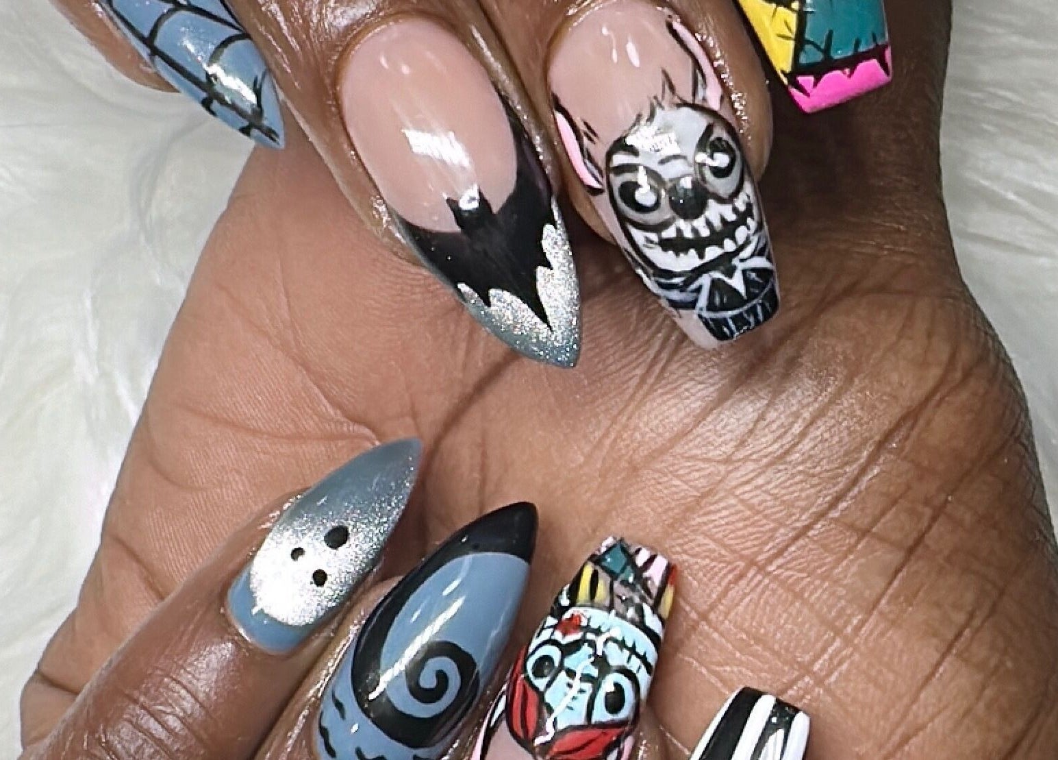 Creative nail art at Nail Luxe, Davie, Florida, US featuring intricate designs and vibrant colors.