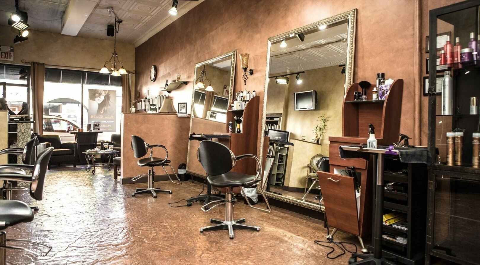 Elegant interior of Salon Nine28 in Nutley, New Jersey, US, showcasing styling chairs and mirrors.